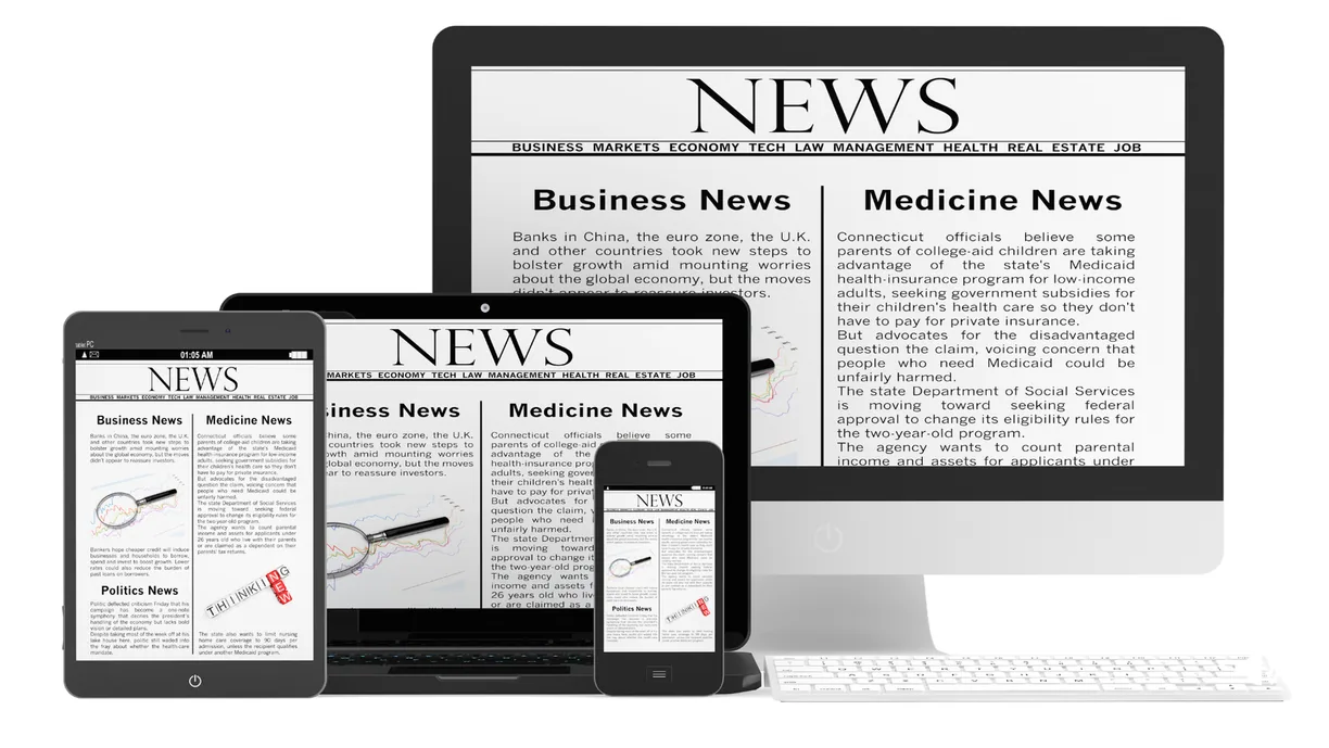 A news site shown on desktop, tablet and phone at once.