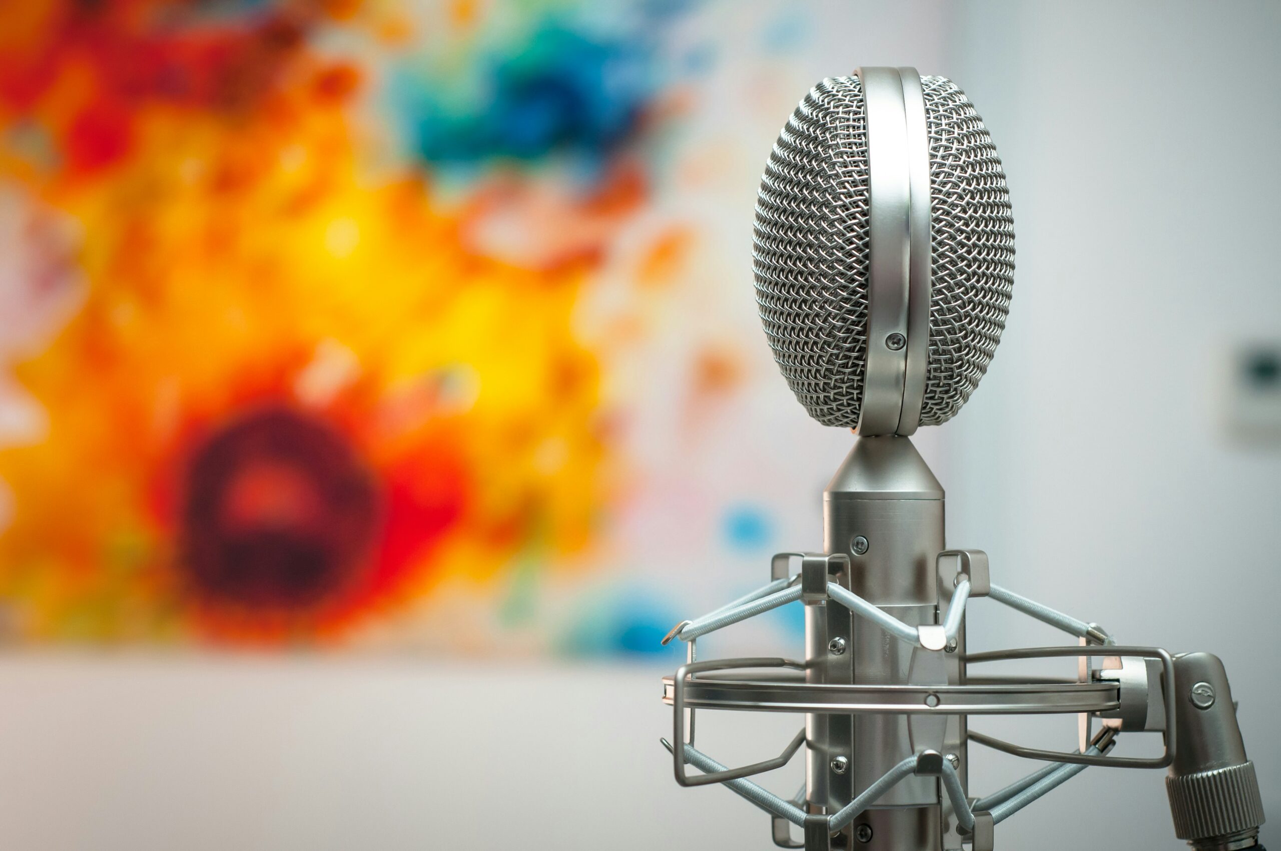 A microphone placed in front of a painting